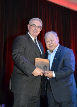 President David Barnard receievs the Golden Dragon Citizen of the Year Award from Dr. Joseph Du // Photo by Howard Lee