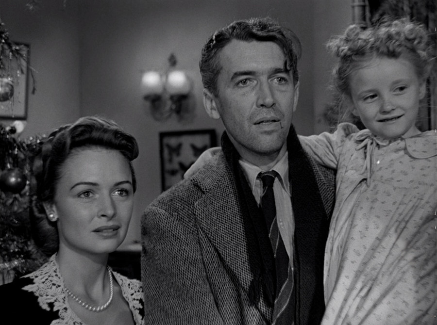 George Bailey (James Stewart), Mary Bailey (Donna Reed) and their youngest daughter Zuzu (Karolyn Grimes).