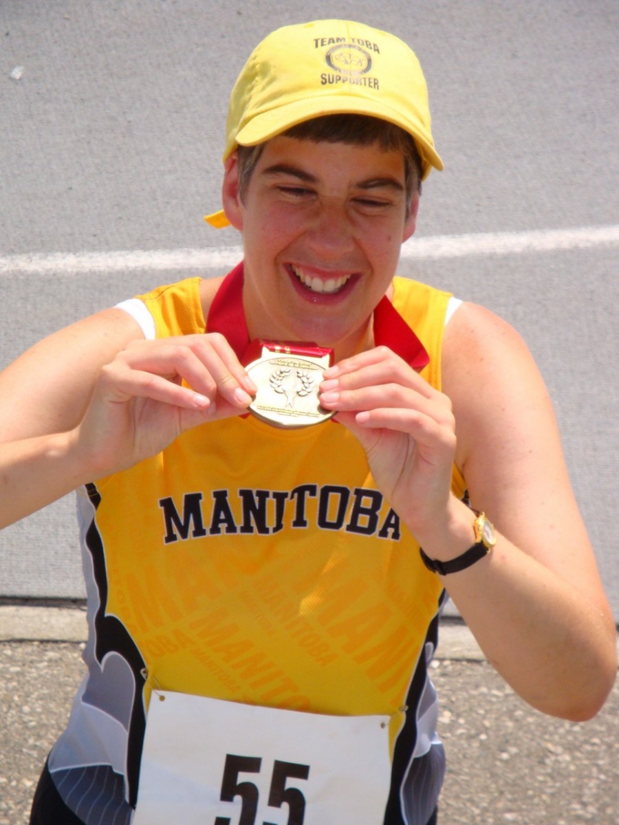 Brita Hall with her medal at the 2010 Special Olympics Summer Games.