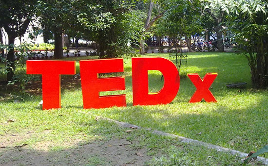 TEDx sign on a lawn
