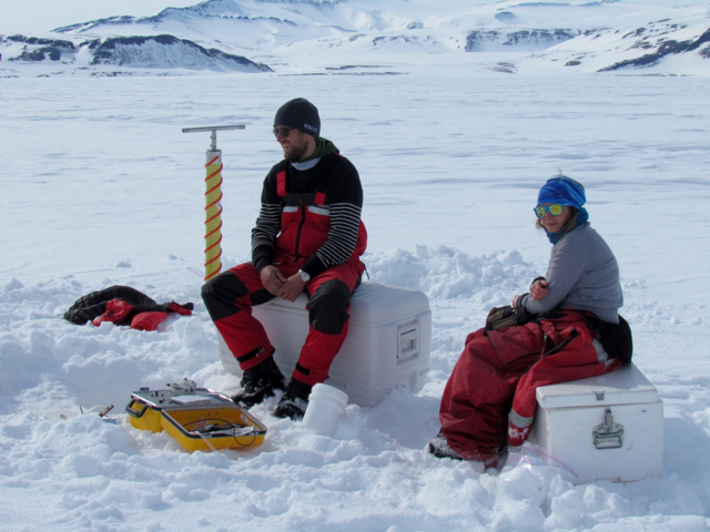 Wieter Boone and Odille Crabeck taking a break during physical sampling of the ice and snow. // Photo Dave Babb