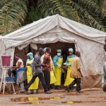 Health workers screen people for the deadly Ebola virus in Sierra Leone. Photo by Michael Duff, Associated Press