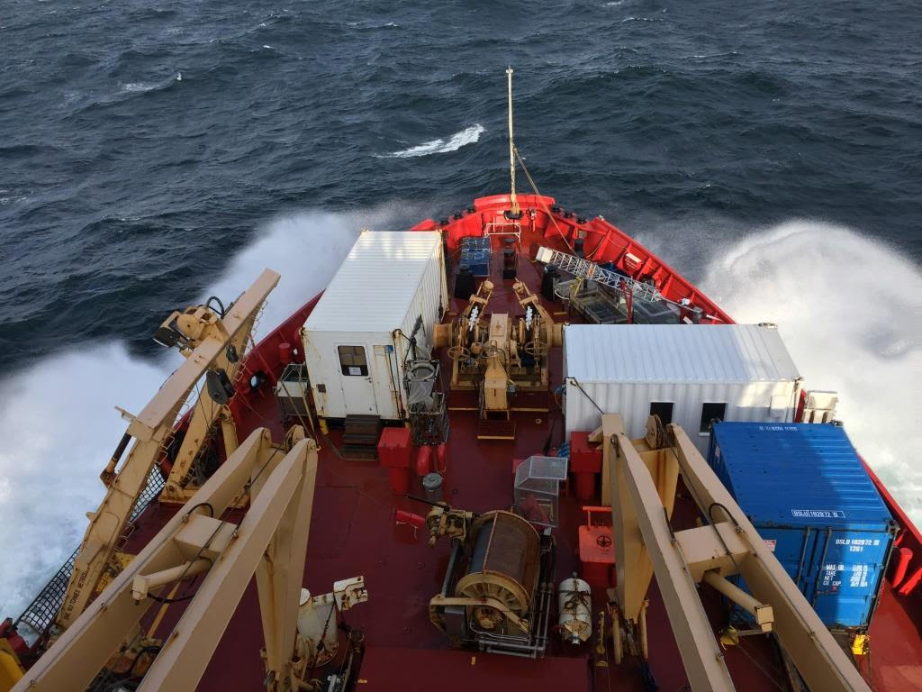 The bow of the NGCC/CCGS Amundsen. Our lab’s atmospheric mercury sampler is visible on the starboard (right) bow above the blue container and to the right of the white container, which housed the instrument’s computer, pump, and analysis units. // Photo by Kang Wang