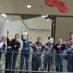 students fly paper airplanes