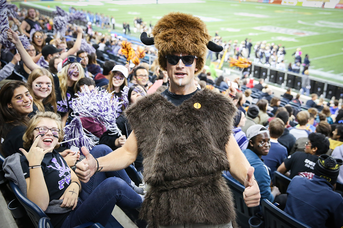 A Bison fan celebrates at the 2015 Homecoming football game // Photo by Mike Latschislaw