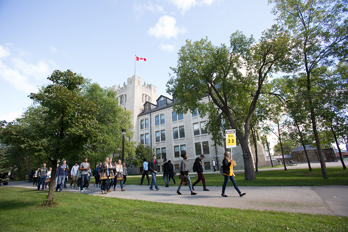 A group of new students parades past Tier building during Orientation // Photo by Marianne Helm