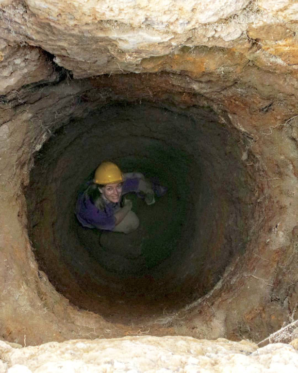 Amber Leenders in an ancient well in Caere