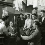 Group of men in a house in Veterans' Village // Photo courtesy of UM Digital Collections
