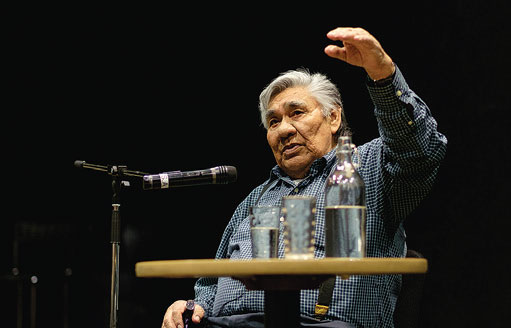 Cree Elder Louis Bird performing the story of Chakapesh at the Millennium Library. // Photo by Warren Cariou