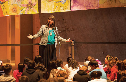 Inspired by her Kiowa Apache grandmother's stories and experiences of Residential schools, featured storyteller, Dovie Thomason shares her stories with students from the Winnipeg School Division at the festival. This event was a partnership between the Mauro Centre, the Winnipeg School Division Project Everybody Has The Right, and the Canadian Museum for Human Rights.