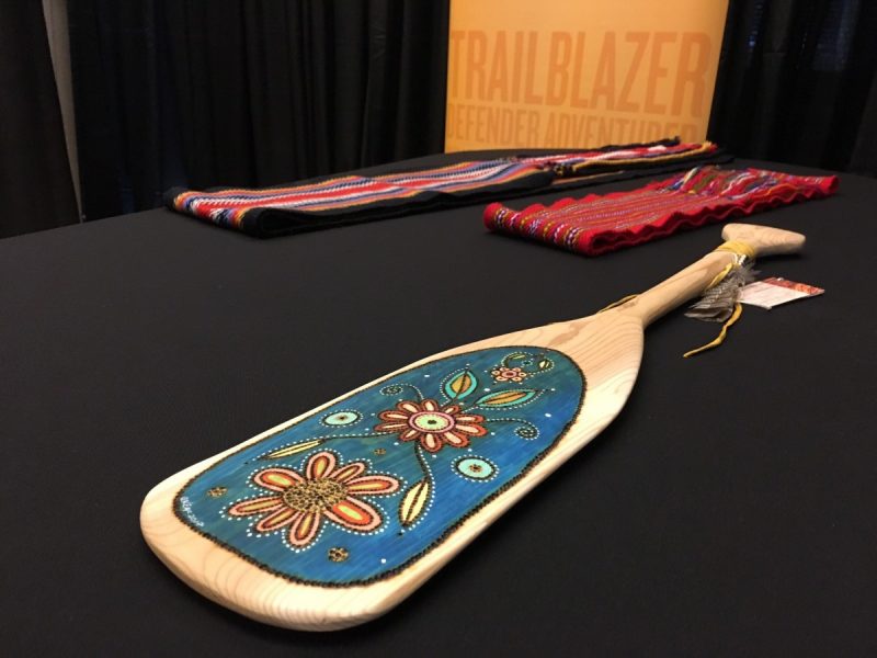 A decorated paddle was presented as a gift to BMO Financial Group, representing the importance of journeys that bring people together