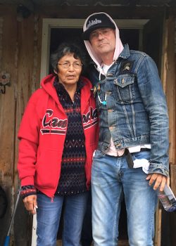 EVELYN BAXTER, CHANIE WENJACK’S SISTER, WITH GORD DOWNIE OUTSIDE HER HOME IN OGOKI POST, ONT. // PHOTO: GRAND CHIEF ALVIN FIDDLER