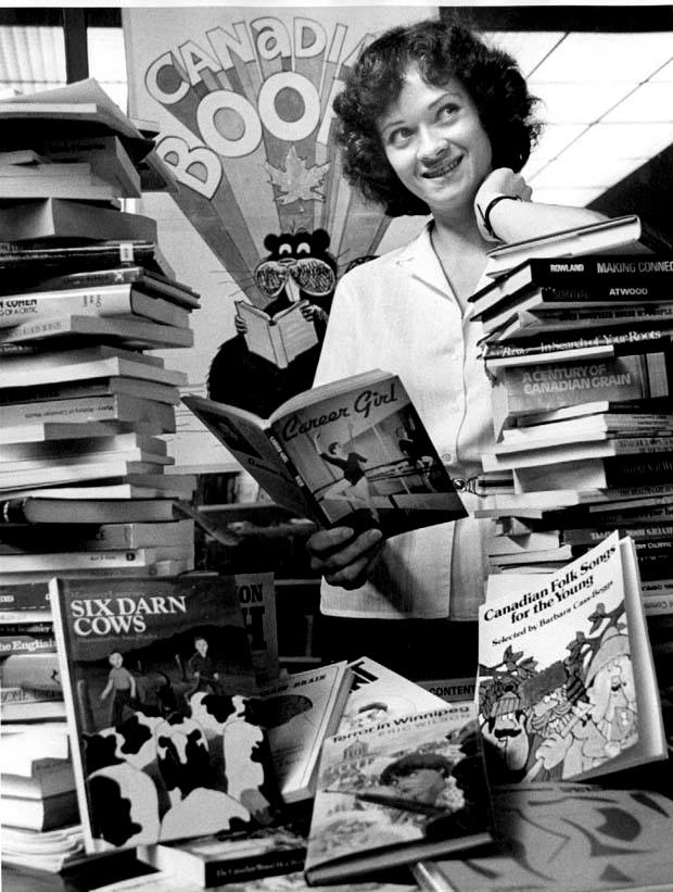 Beth Morrison browses through some of the novels at the University of Manitoba's second annual Canadian Publishers' display.<br />
Source: Winnipeg Tribune fonds