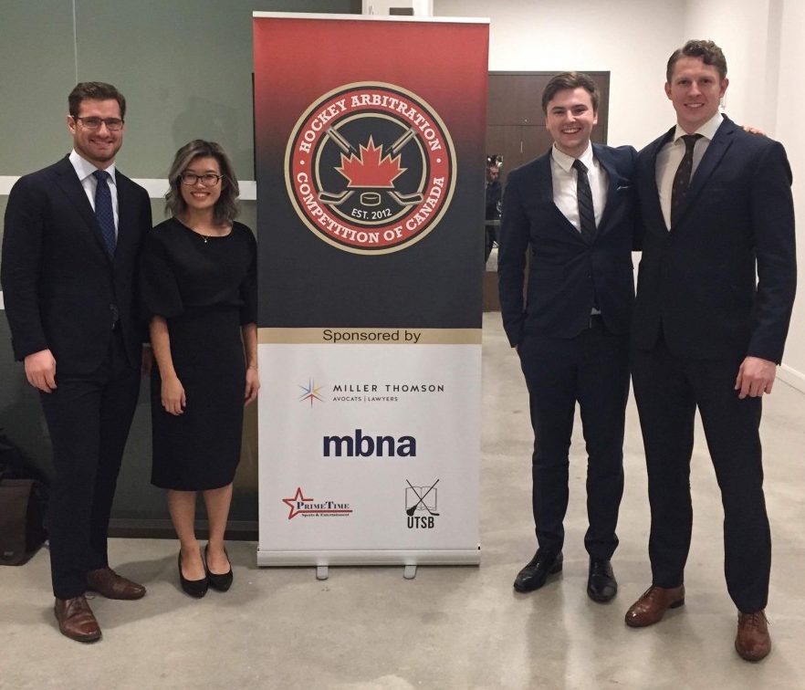 Robson Hall teams competing at the Hockey Arbitration Competition: (left to right) Mark Alward, Vienna Luong, Carter Liebzeit, and Christian Pierce. Photo by Alana Robert