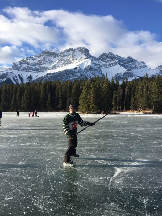Dupuis skating on Two Jack Lake in Banff National Park, with Cascade Mountain in the background.