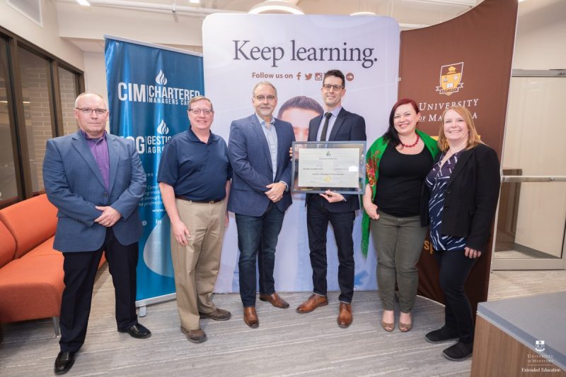 Representatives from both CIM/Chatered Maniagers Canada and Extended Education celebrate CIMA program accreditation.