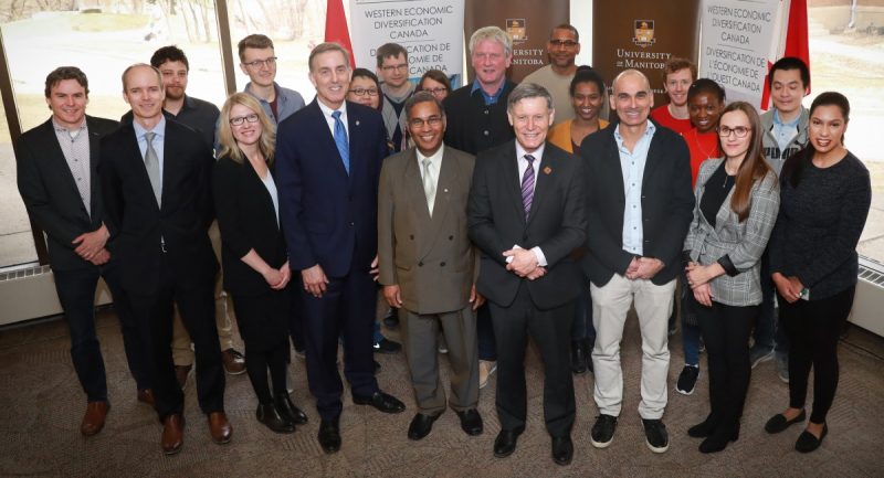 Drs. Jorg Stetefeld (centre) and Gregg Tomy (3rd from right) and their teams, with MP Terry Duguid (4th from right) and Dr. Digvir Jayas (5th from right).