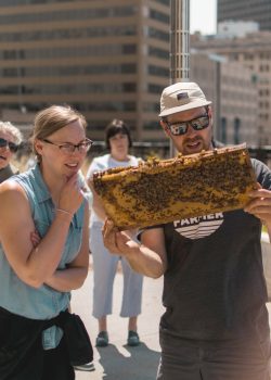 Chris Kirouac gives an inside look at Red River College’s rooftop hive to employees. // Photo from Lucas Smith