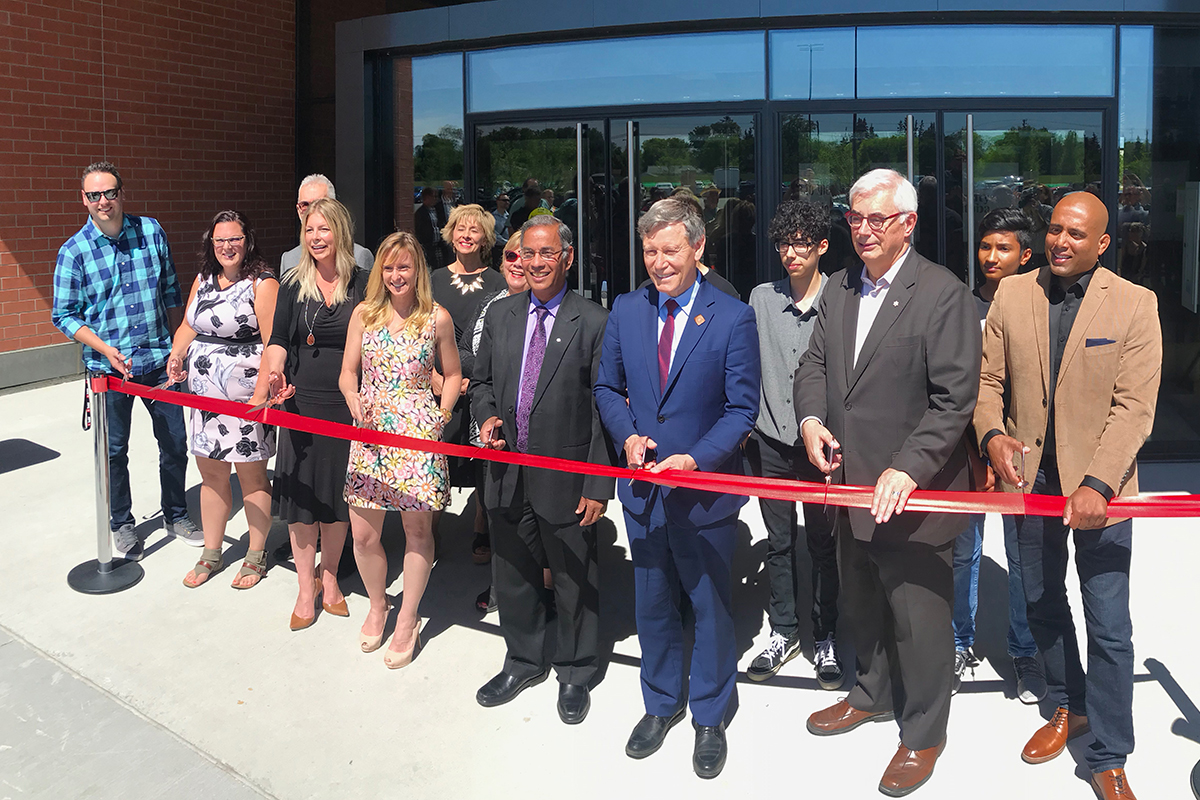 Among those helping to cut the ribbon at the opening of the Smartpark Innovation Hub were (left to right): Stefan Maynard, BOLD Commerce; Amanda Meyer, Cibus Canada; Jane Bachart, Pembina Trails Early College School; Dr. Jody Dexter, UM's Technology Transfer Office; Dr. Digvir Jayas, UM VP; MP for Winnipeg South Terry Duguid; Dr. David Barnard, UM President and Vice-Chancellor; and Jerin Valel, Board member, North Forth Technologies. 