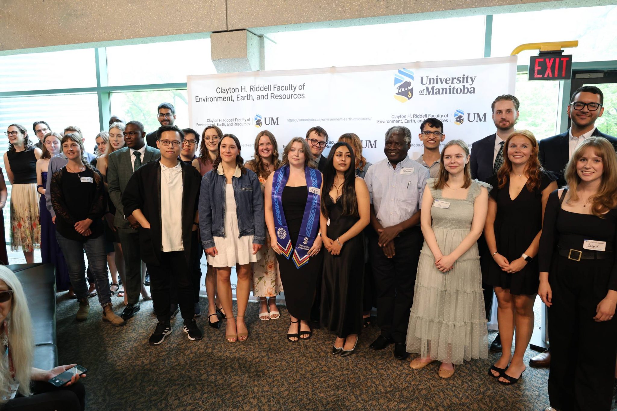 A large group photo featuring many graduating students from the 2025 Spring Convocation Reception.