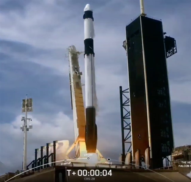 A groundshot showing a rocket launching.