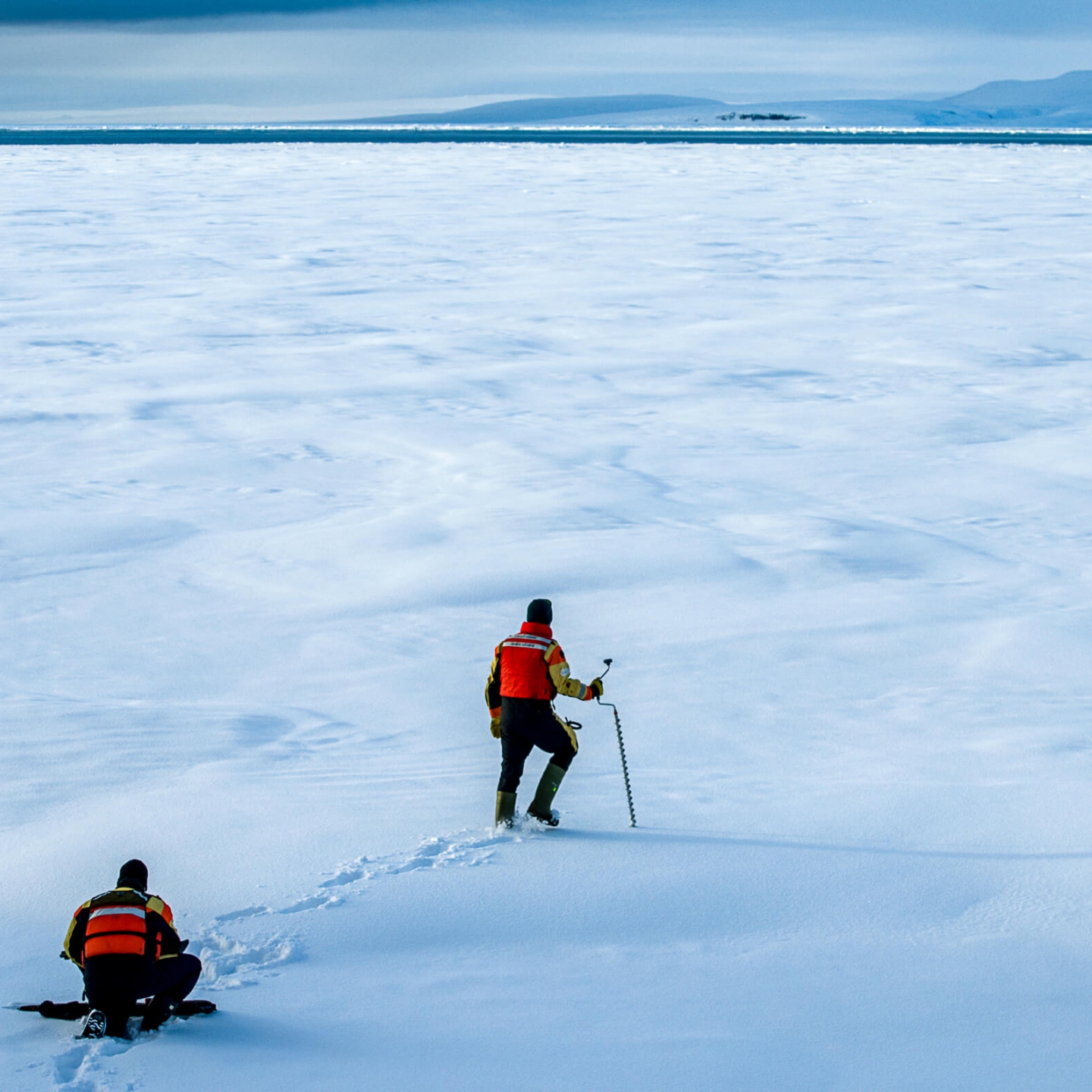 A researcher walks on the ice