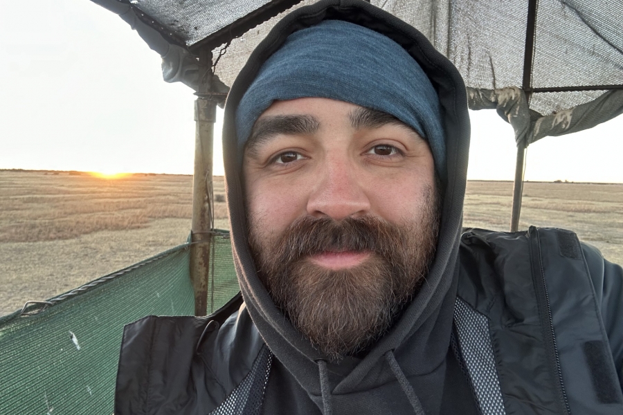 Man with beard outside at sunrise