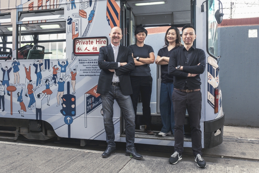 Four people stand confidently in front of a decorated tram labeled "Private Hire," showing teamwork and professionalism. The tram features playful, colorful illustrations.