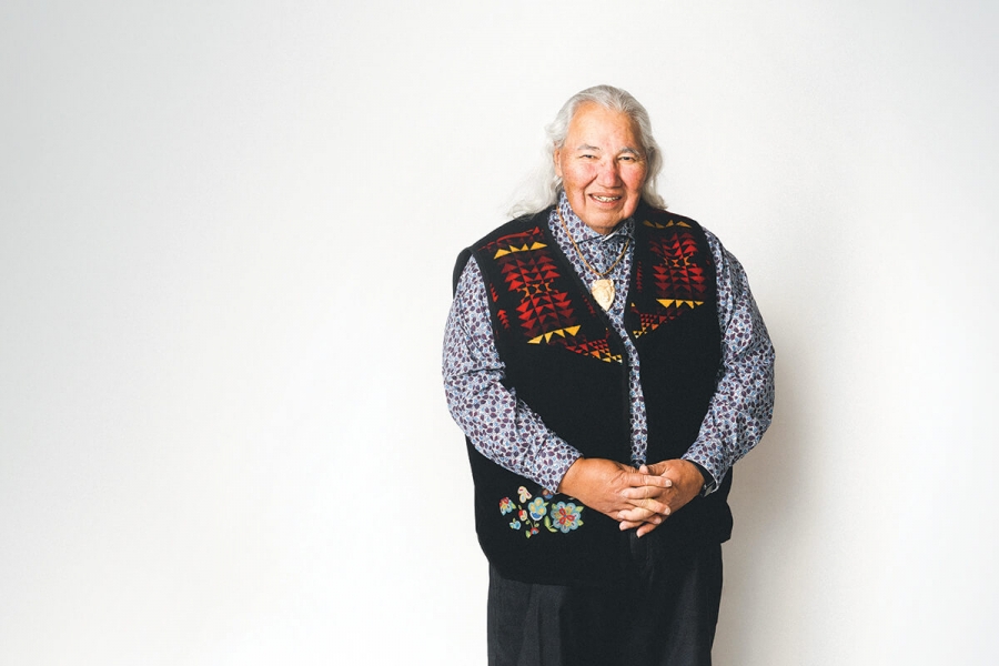 Murray Sinclair poses against a white wall.