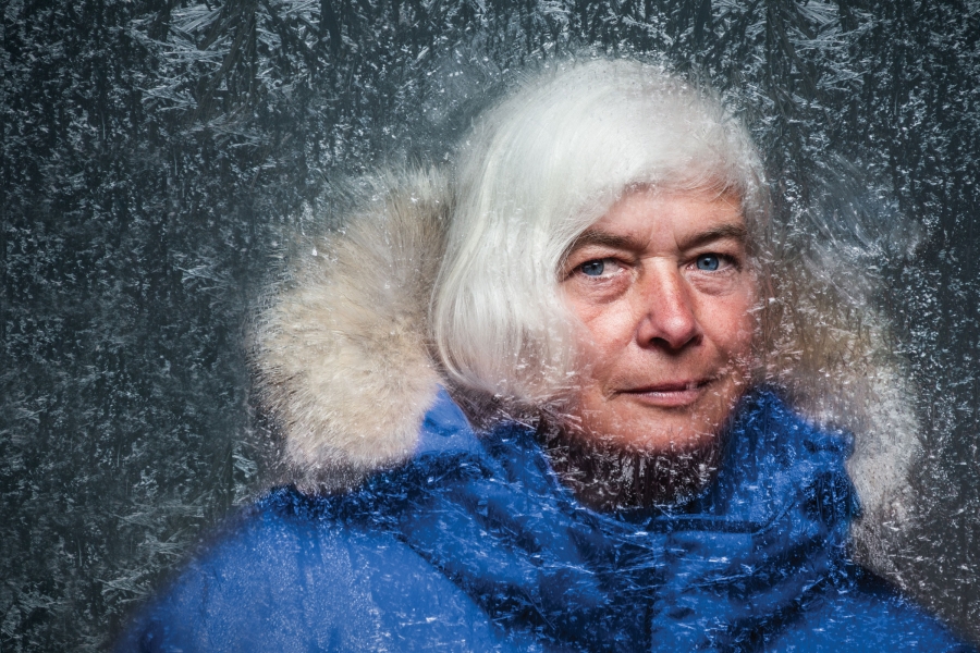 Dorthe Jensen in a blue parka, with ice surrounding her face.
