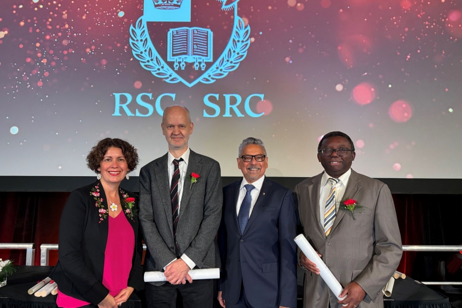 Dr. Mario Pinto, Vice President (Research and International) pictured with three RSC scholars on stage at the ceremony in Waterloo, Ontario.