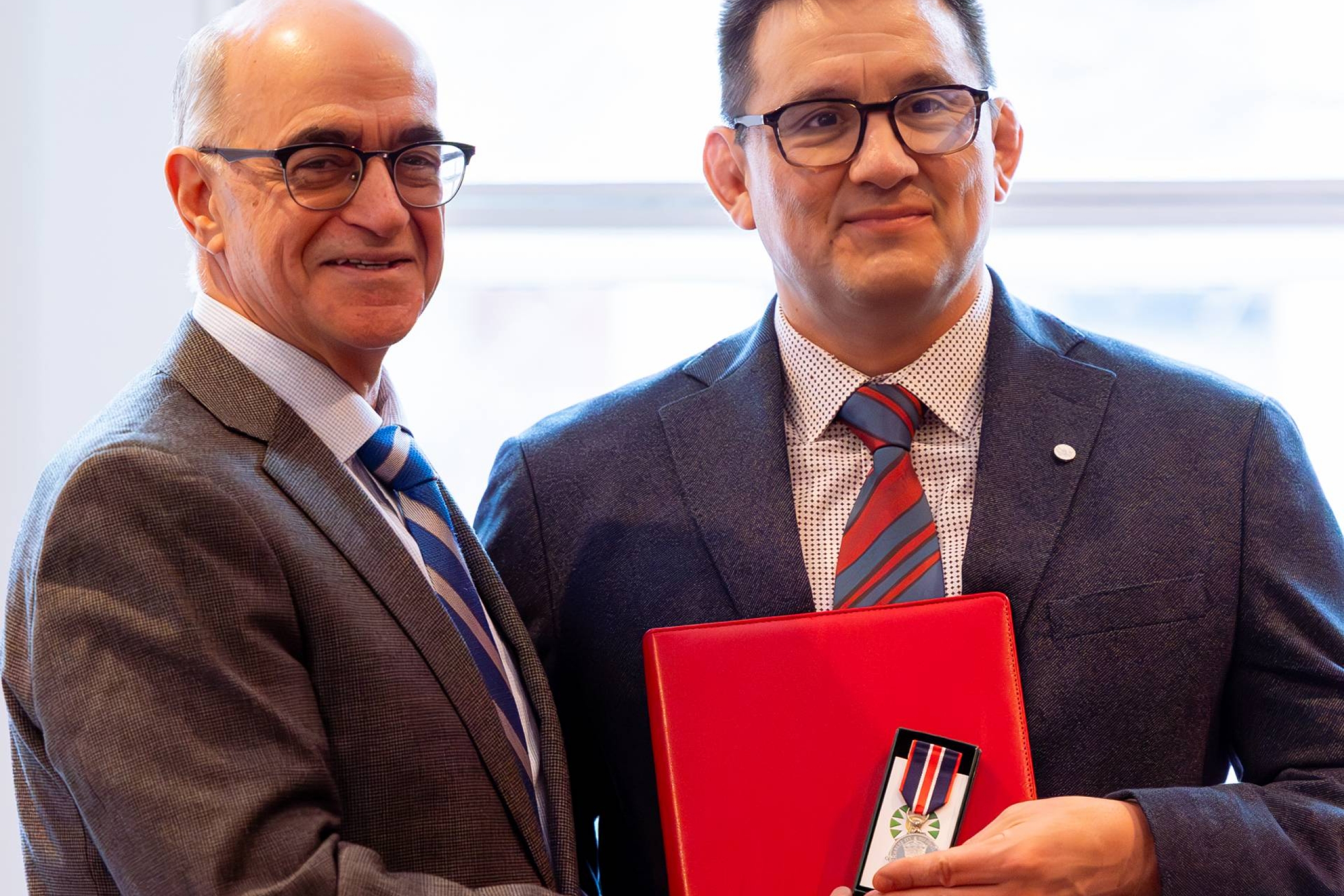 Dr. Frank Deer accepts award and medal