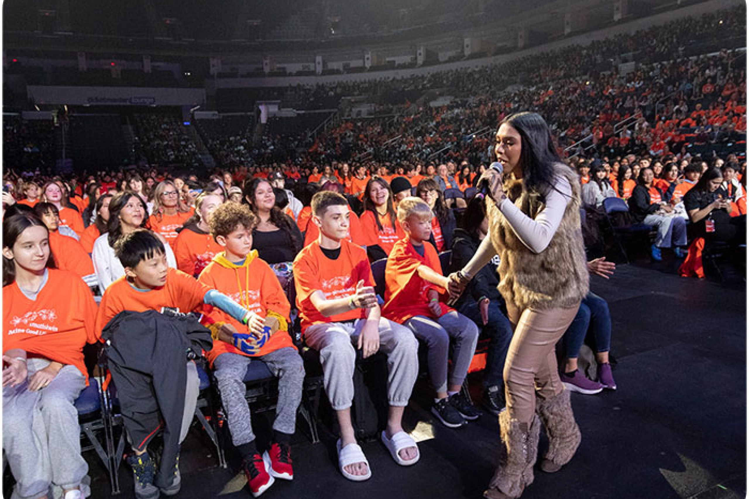 Youth watching a singer perform at NCTR's live youth gathering event