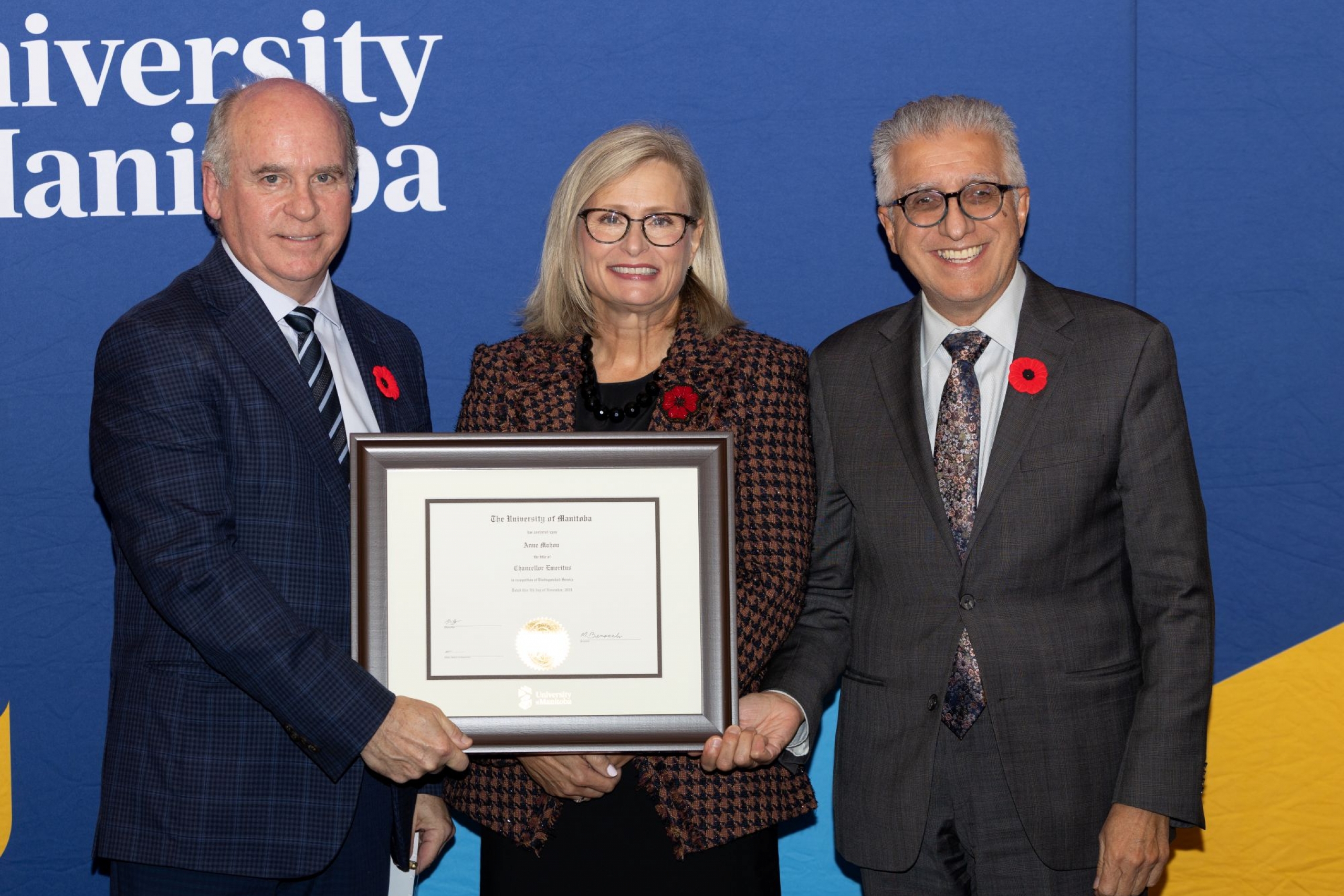 Chancellor Dave Angus and President Michael Benarroch present Anne Mahon with certificate for Chancellor Emeritus.