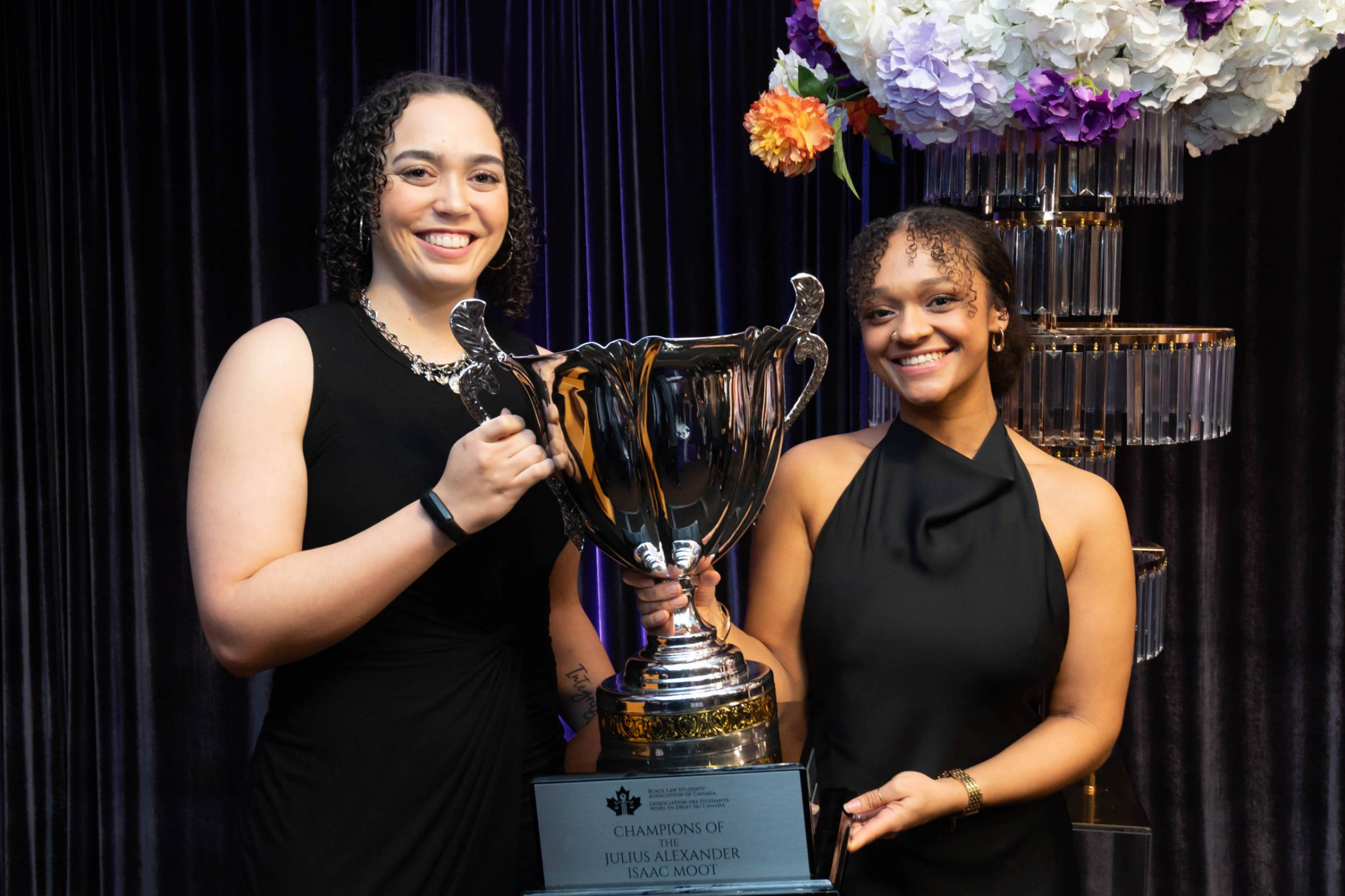 Quinn Thomas and Talia David with the Isaac Moot Cup. 