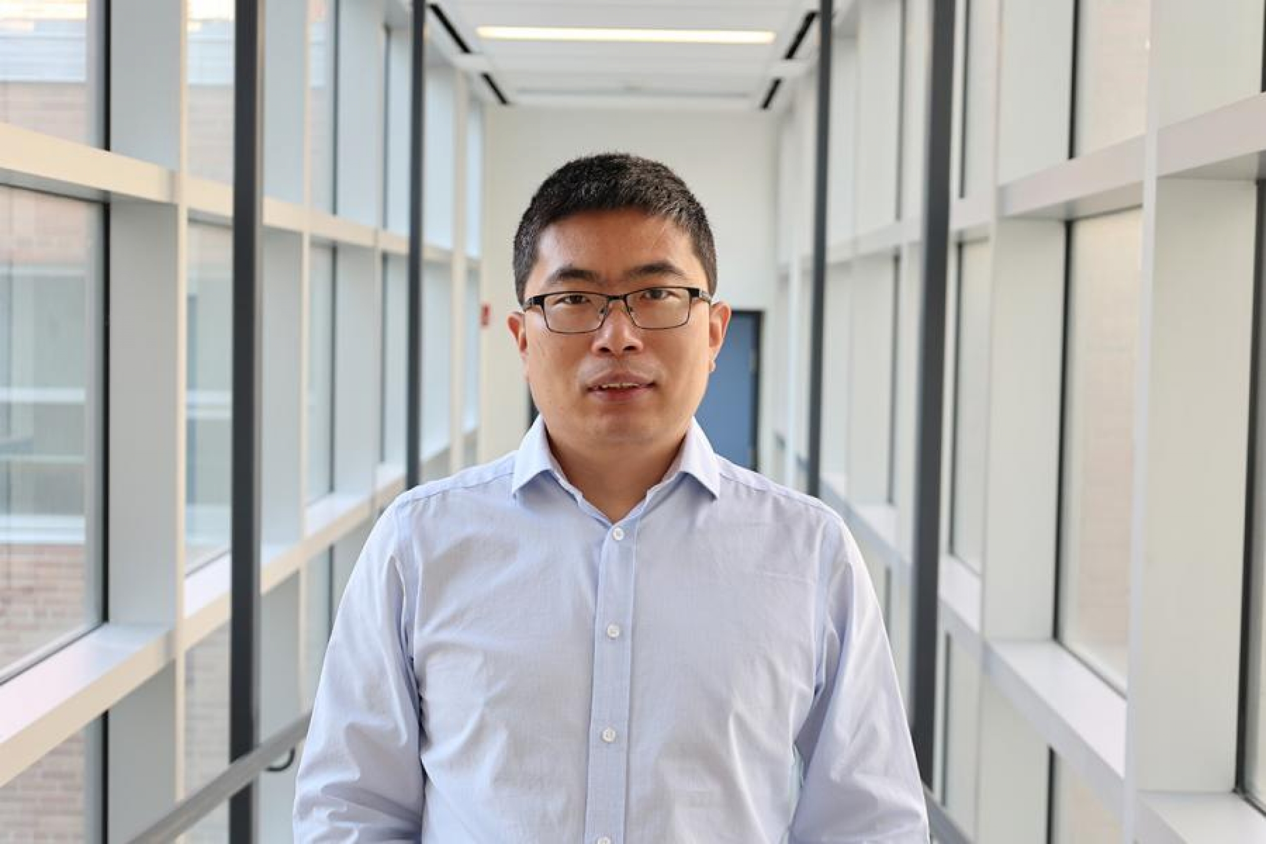 Man standing in a hallway.