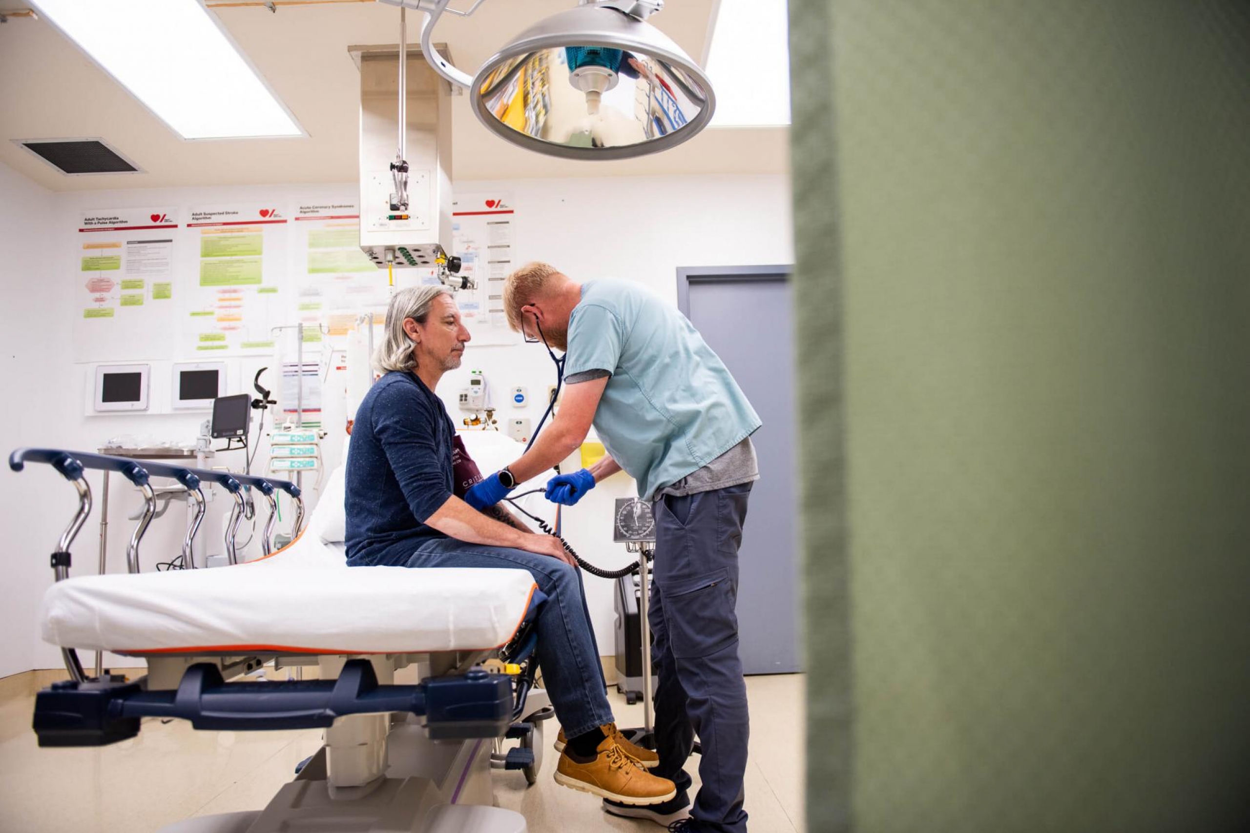 A doctor checks on a patient.