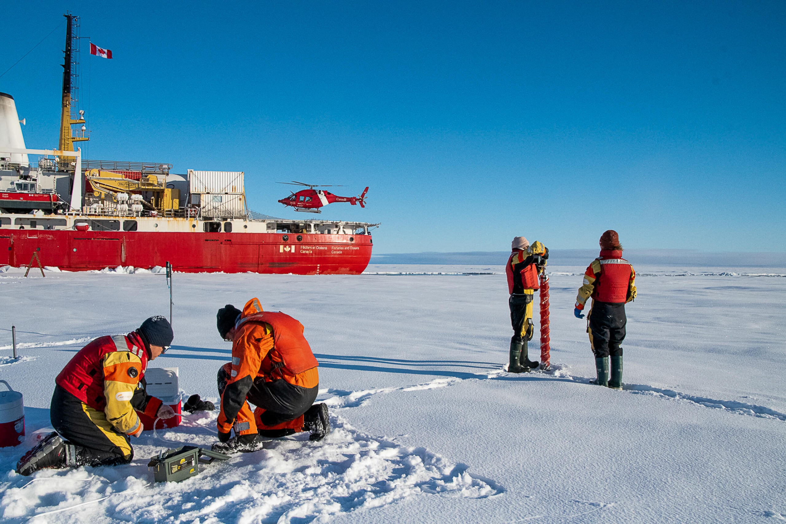 researchers work on the ice