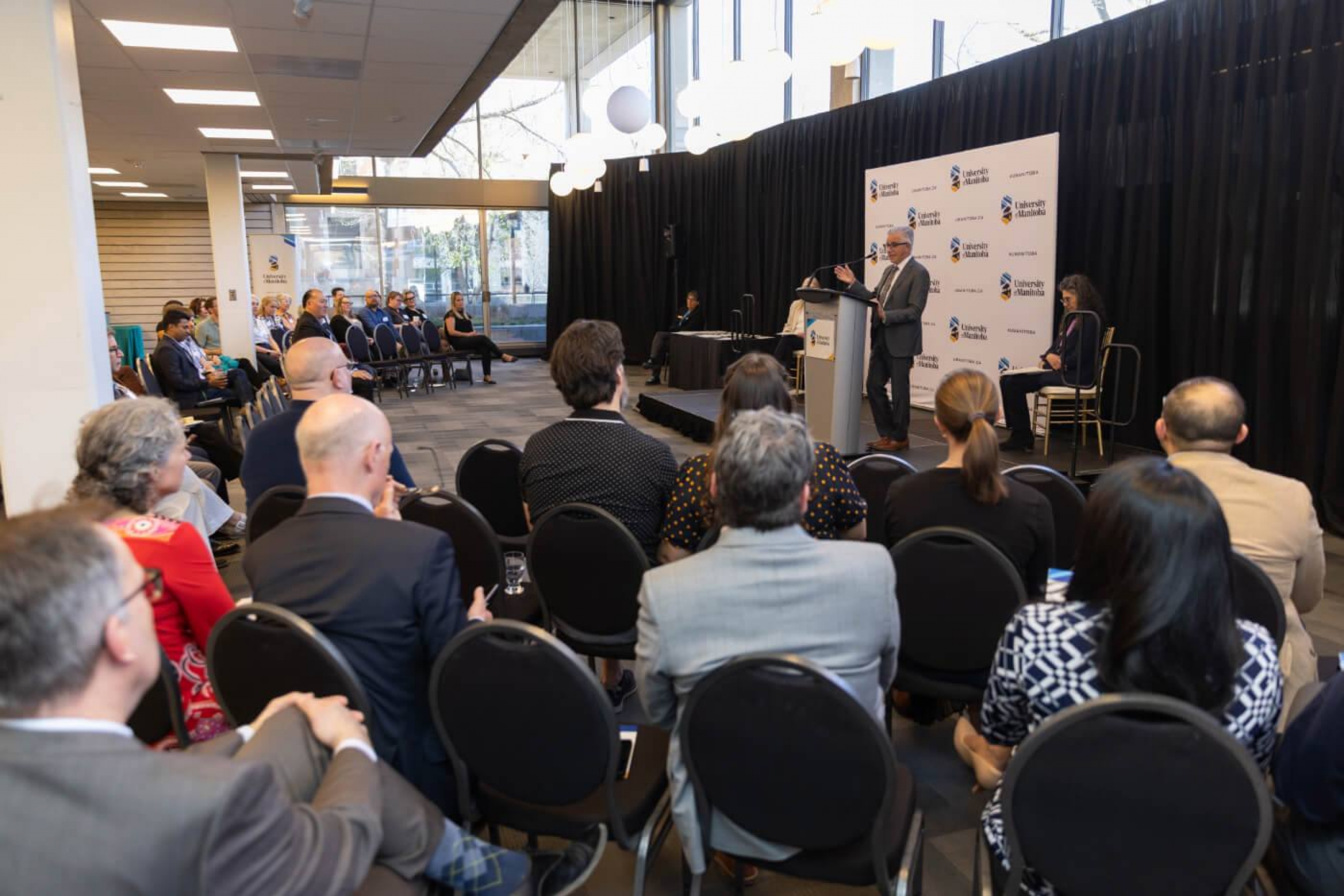 Award recipients and guest listen to Michael Benarroch at the Faculty Recognition Reception 2025