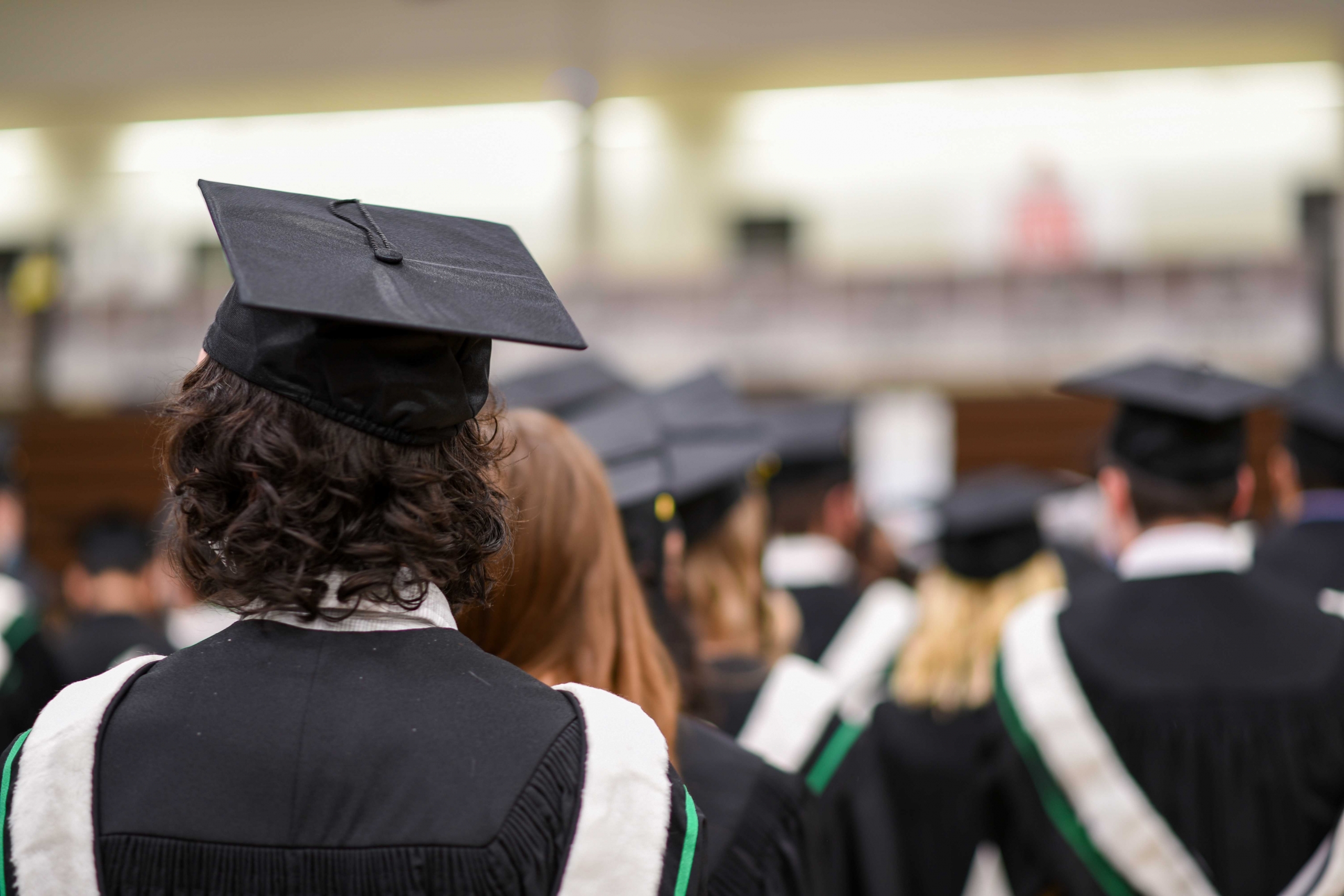A University graduate's cap is seen from behind