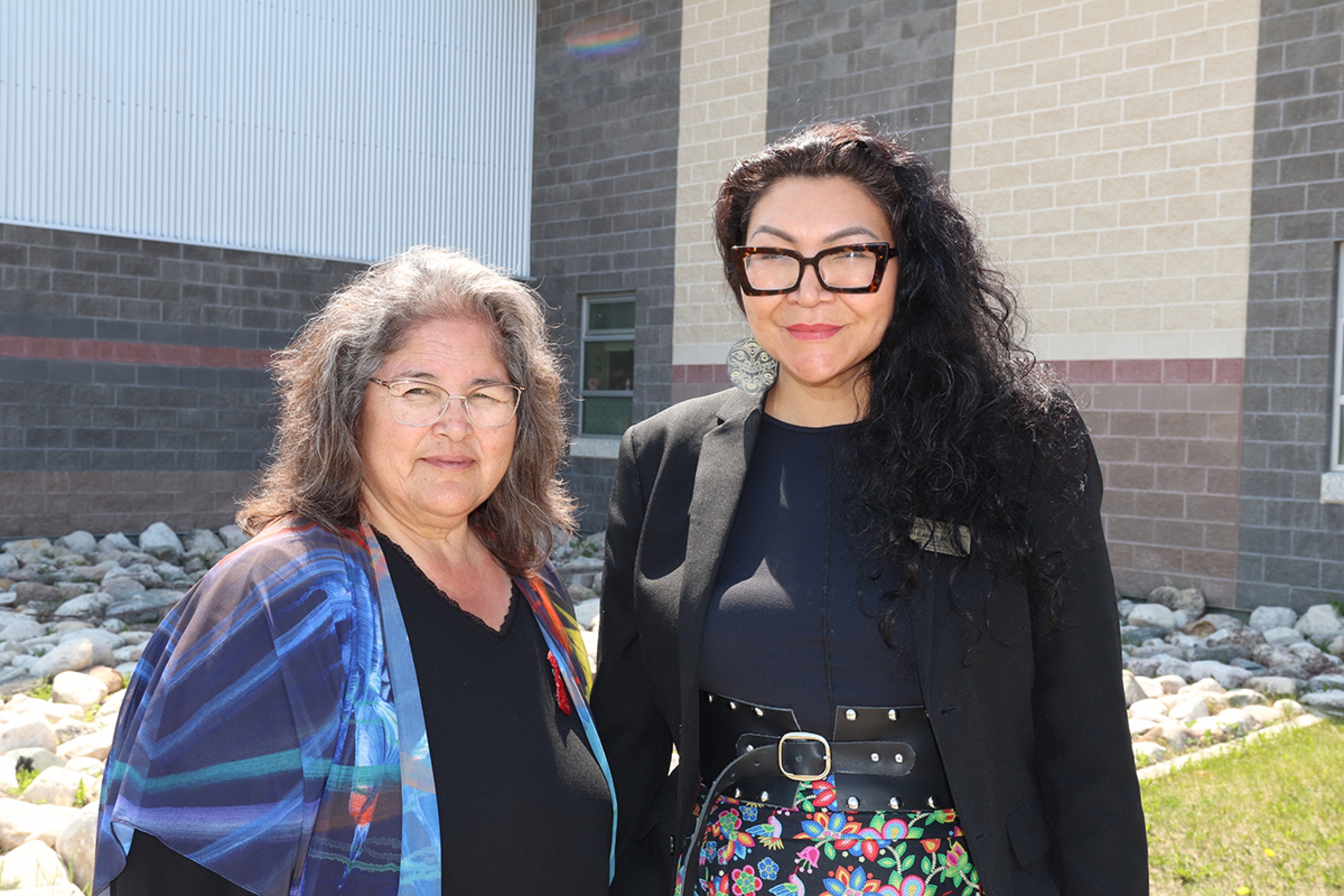 Marlene Head and Margaret Hart outside Oscar Lathlin Collegiate.