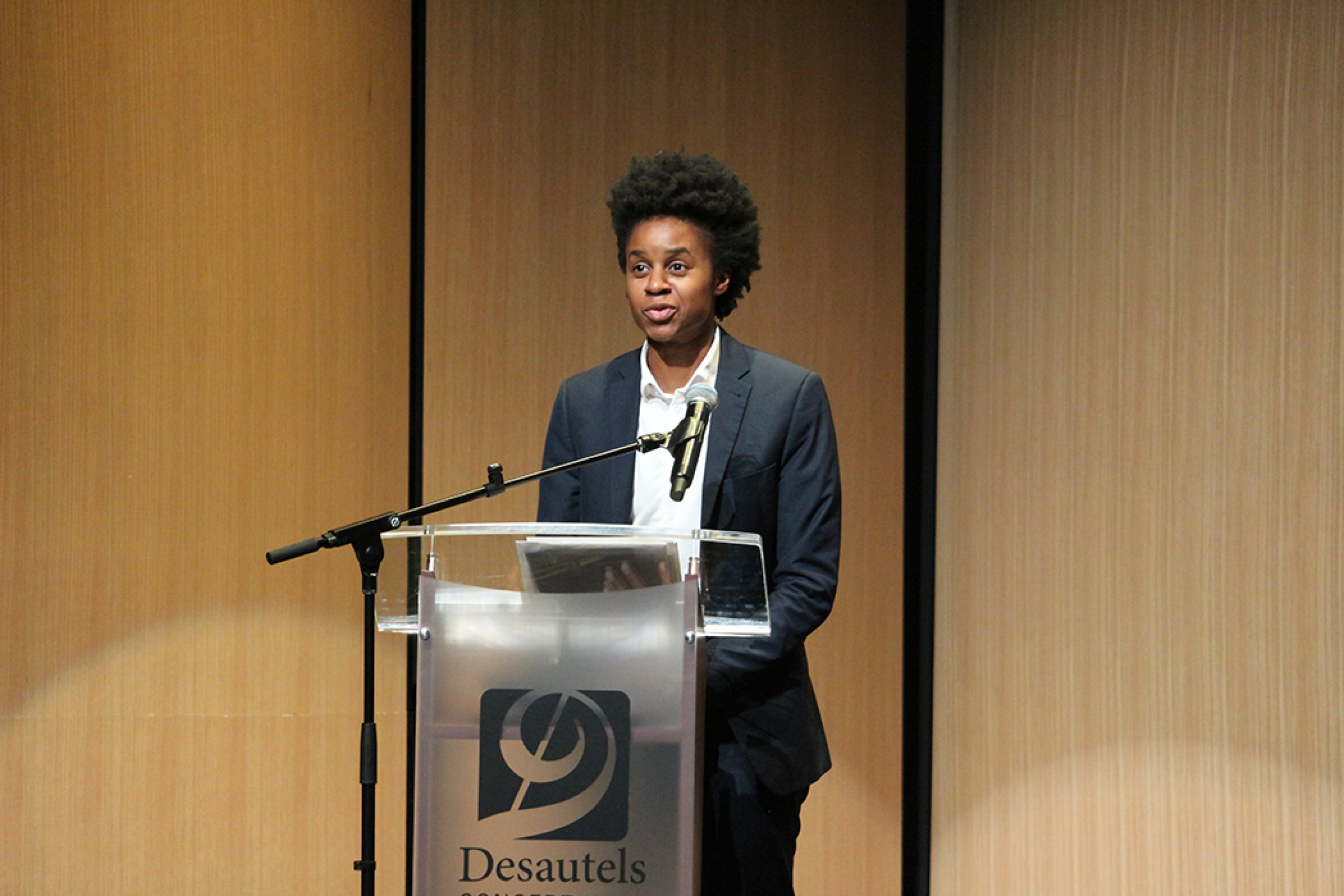 Hon. Uzoma Asagwara speaking at a podium.