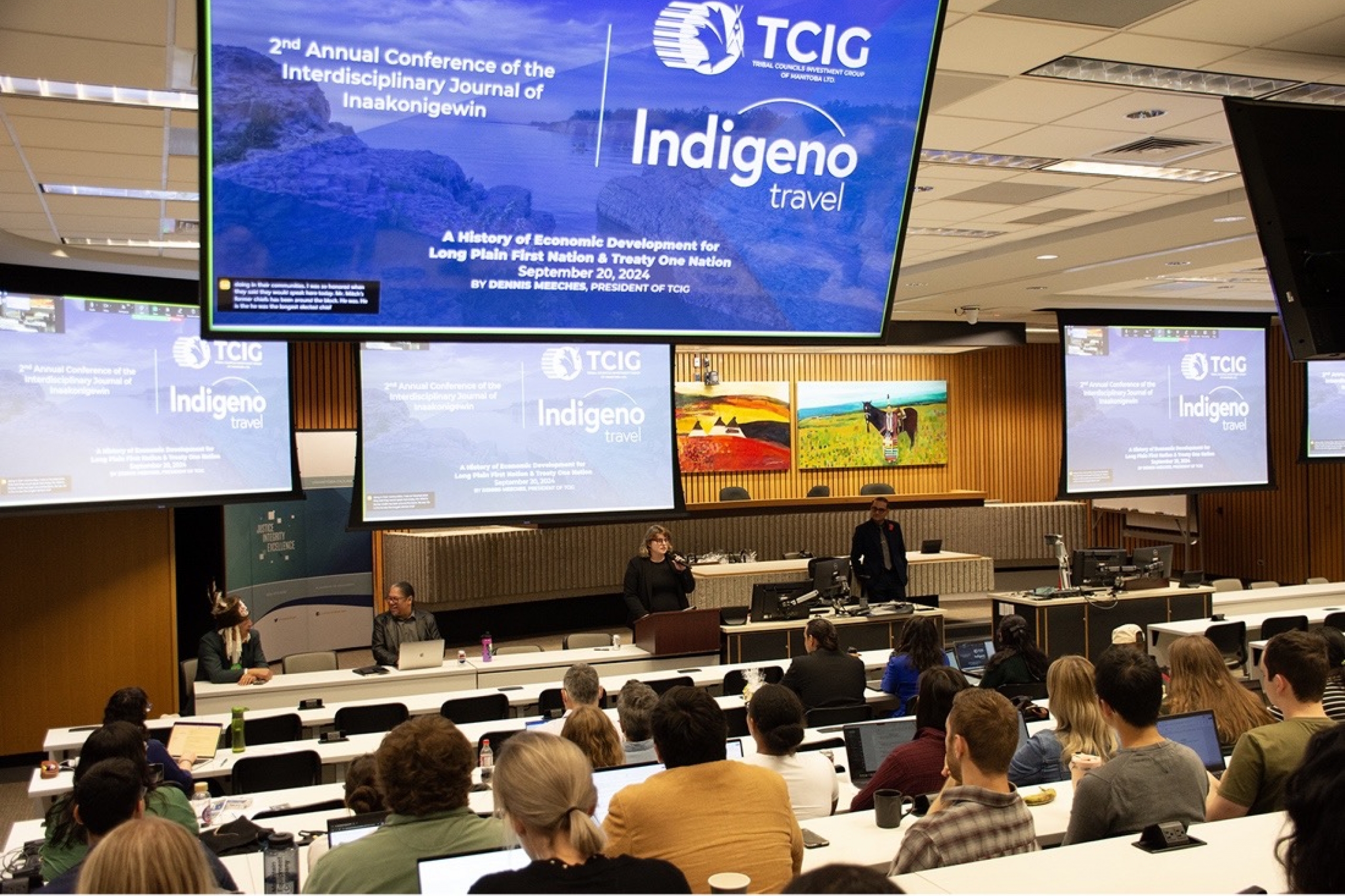 Law student Cody-Wyoming Clark introduces Dennis Meeches at the 2nd Annual Conference of the Interdisciplinary Journal of Indigenous Inaakonigewin