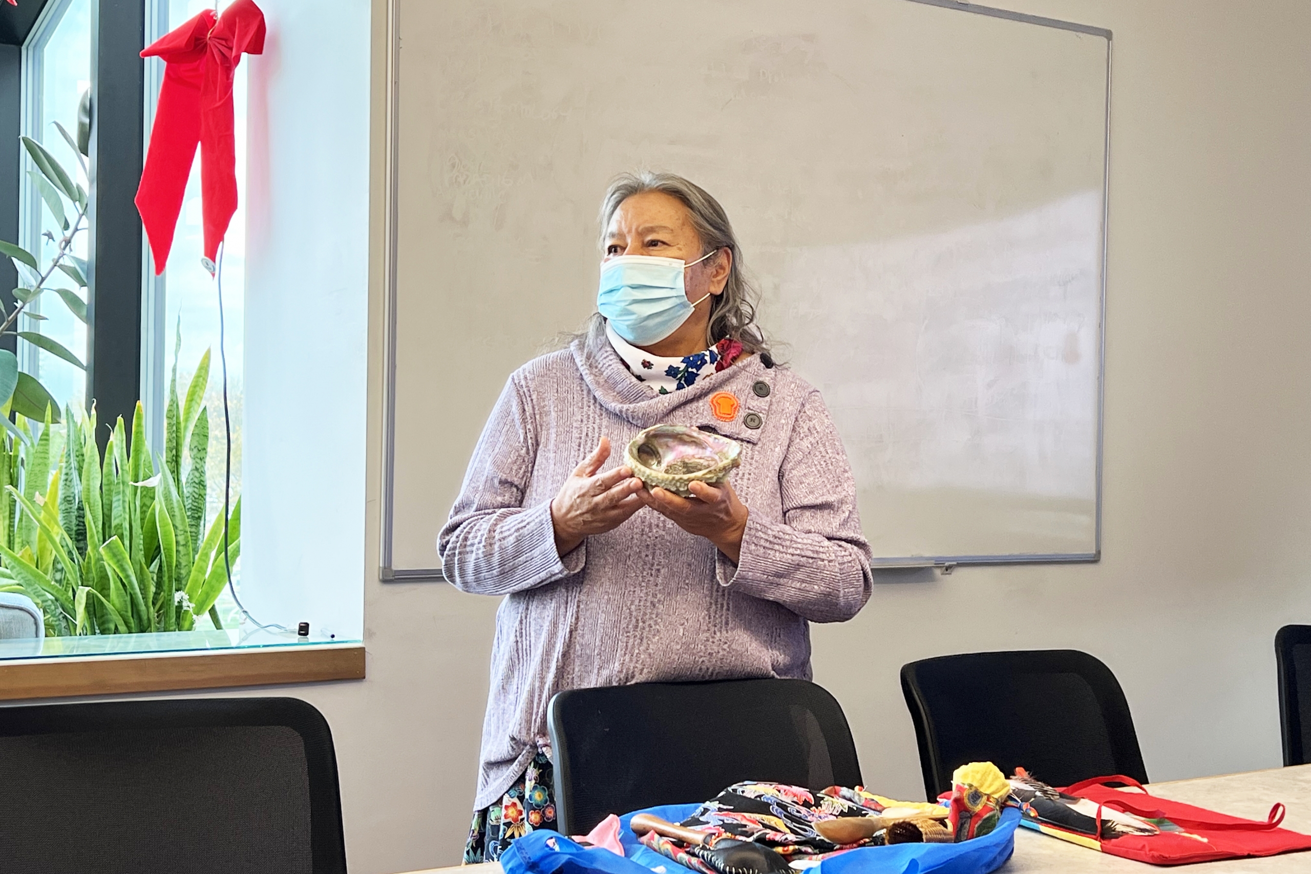 Anishinaabe Elder and knowledge keeper Phyllis Pinesse holds a precious shell.
