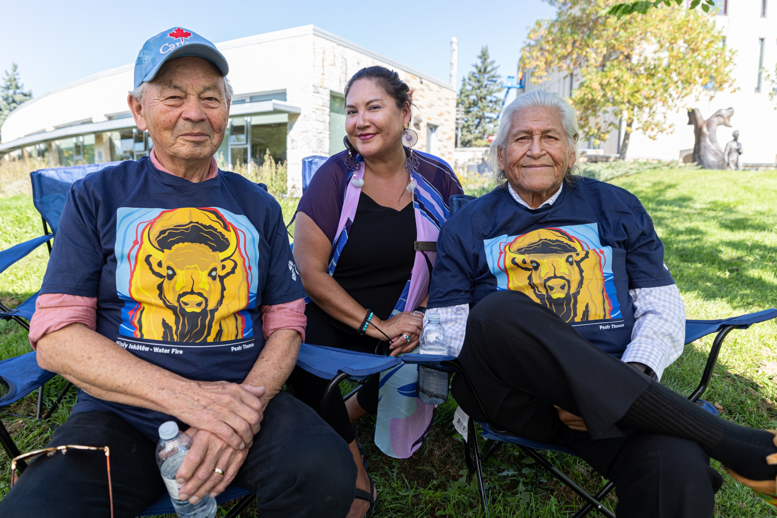 Two male Elders and a female staff member.