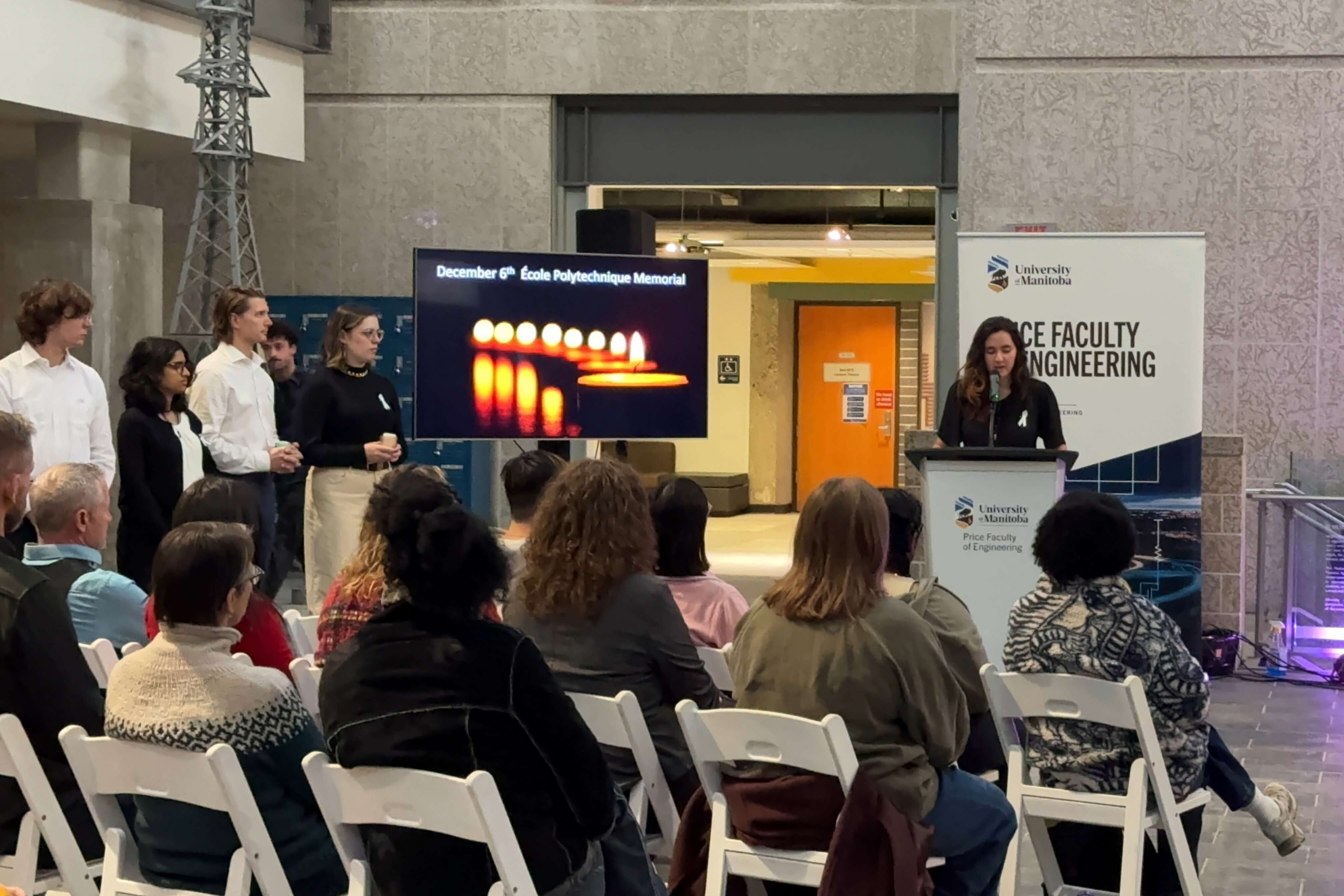 A student reads list of names for memorial event