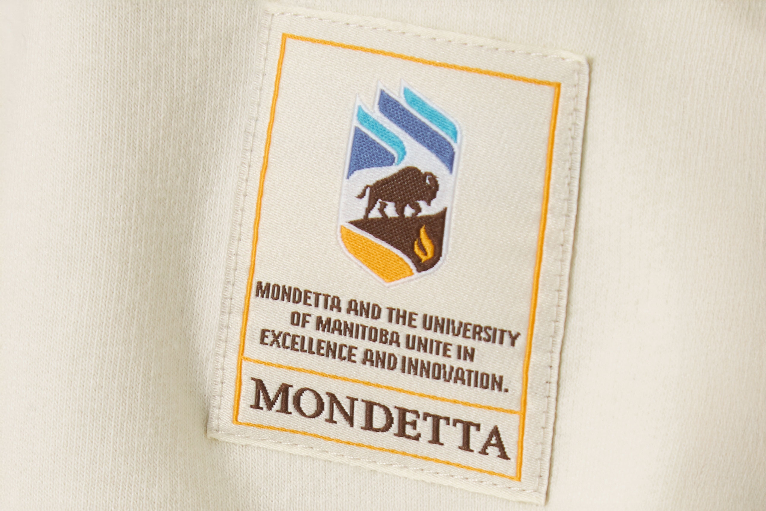 Mondetta and UM excellence and innovation patch