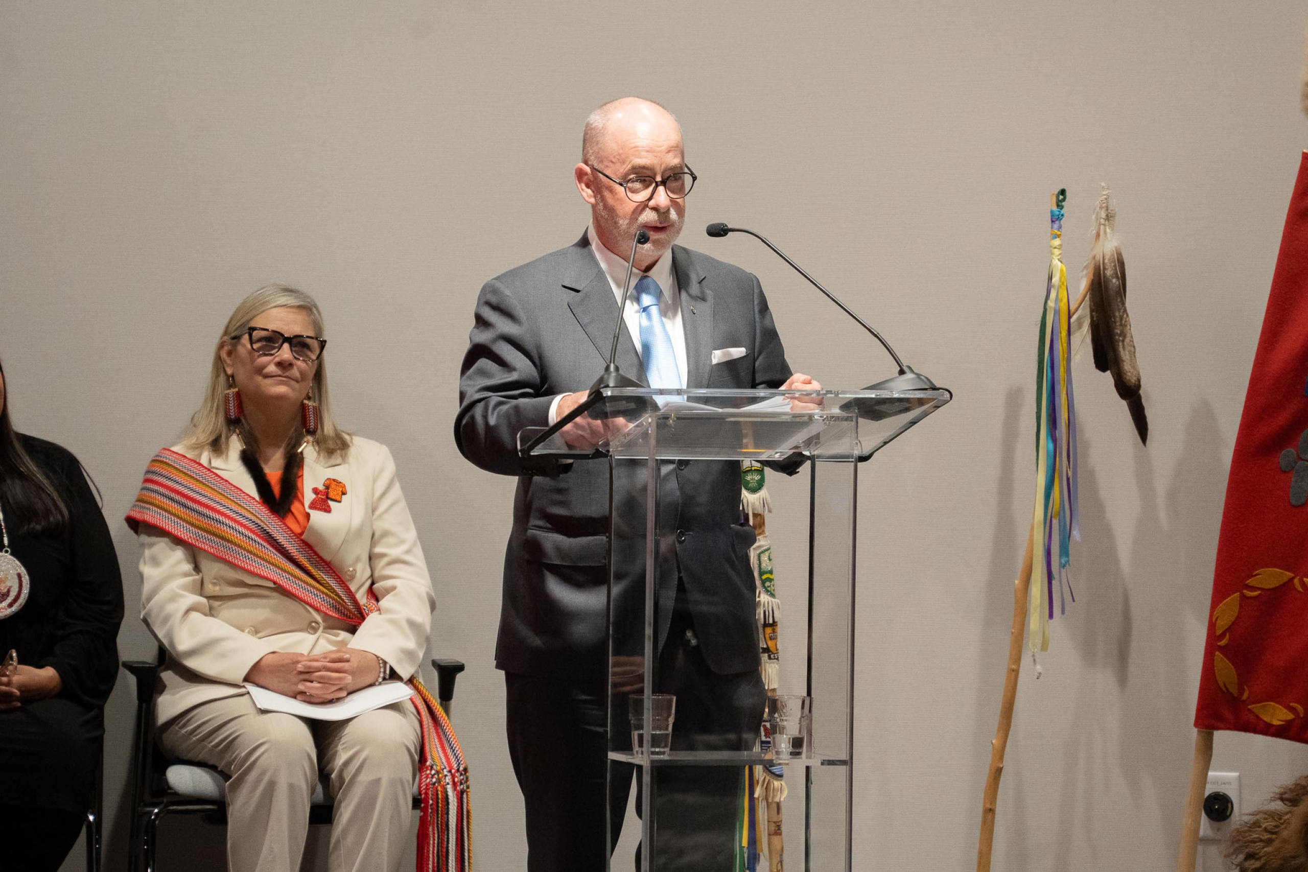 Paul C. Genest at podium