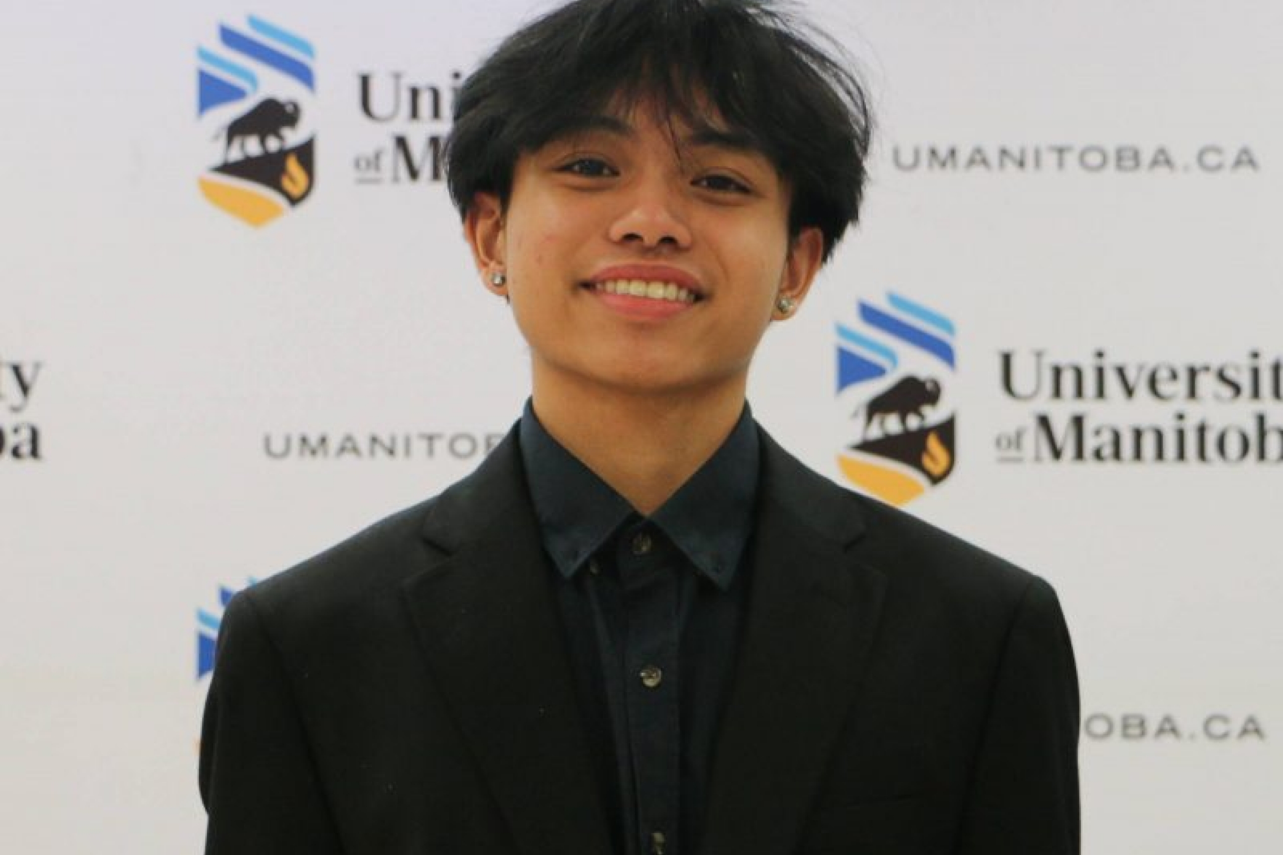Young smiling man wearing a suit