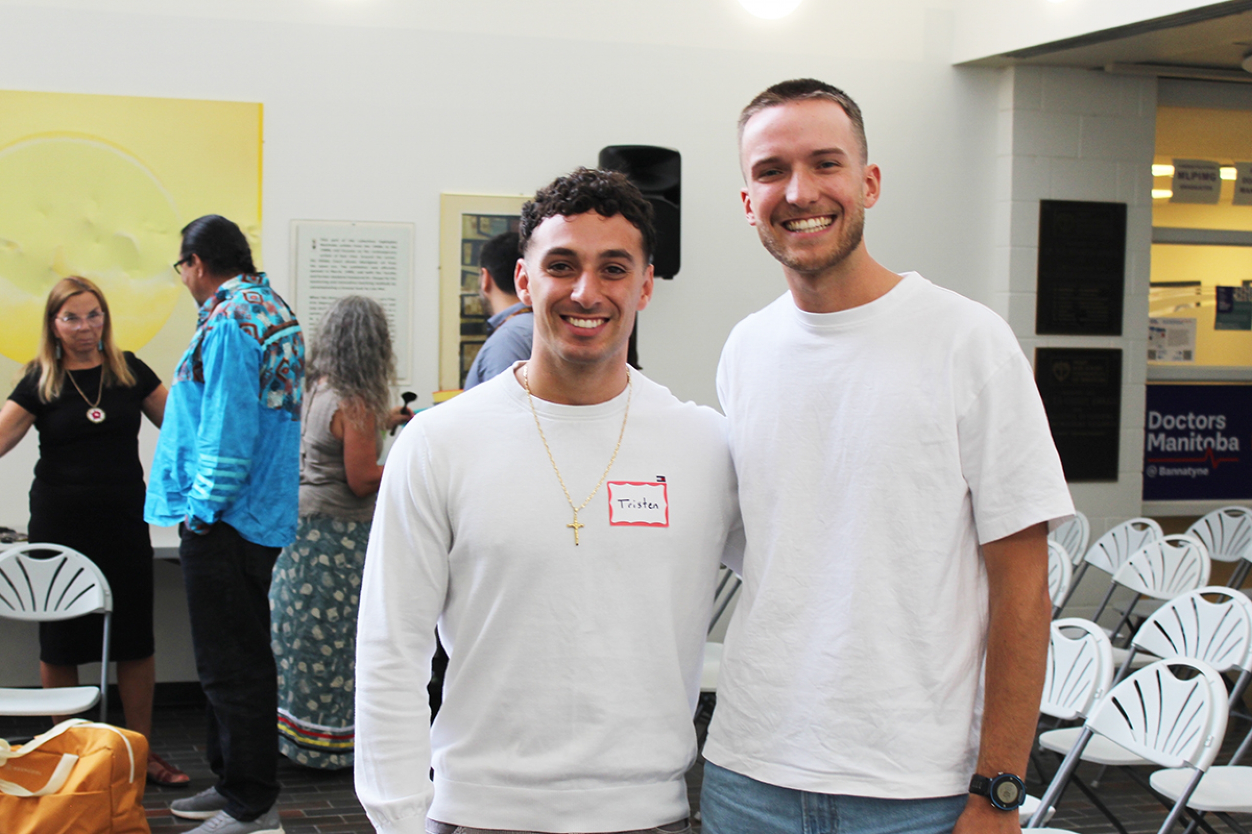Tristen Hutter and Calvin Reimer pose after a ceremony.
